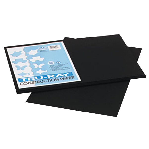 A stack of black Pacon construction paper sheets.