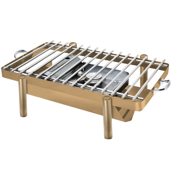An Eastern Tabletop bronze coated stainless steel grill stand with removable grill top on a table.