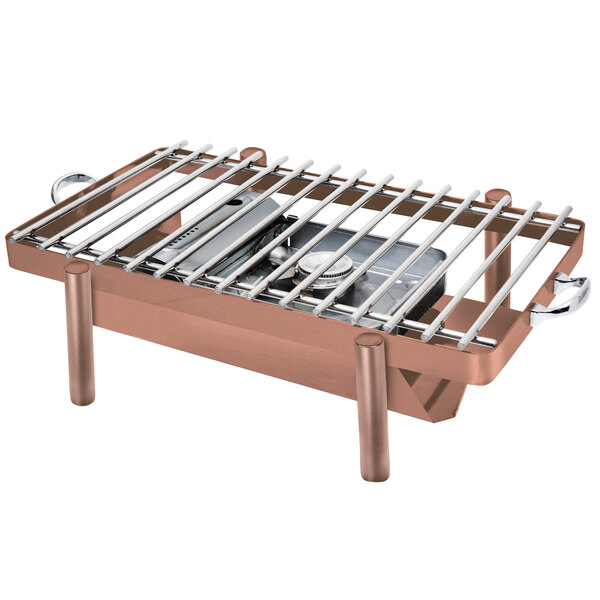 An Eastern Tabletop copper coated stainless steel grill stand with removable grill top on a table.