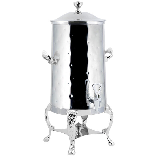 A silver metal Bon Chef coffee chafer urn with a lid on a stand.