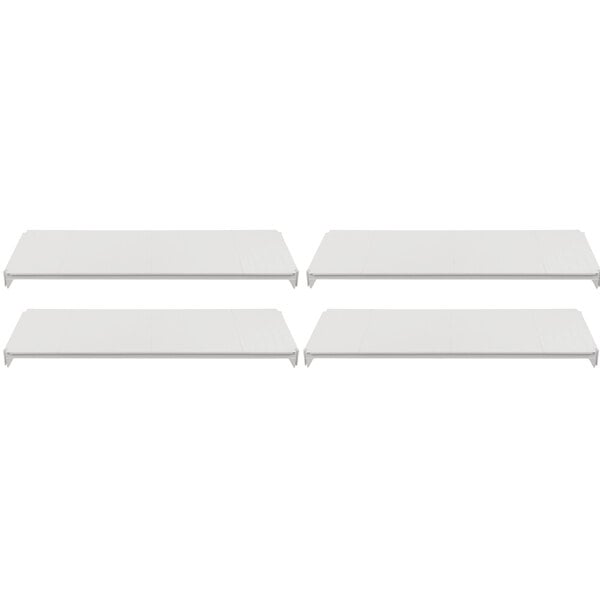 A row of three white rectangular shelves.