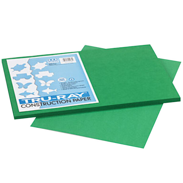 A stack of holiday green Pacon construction paper.