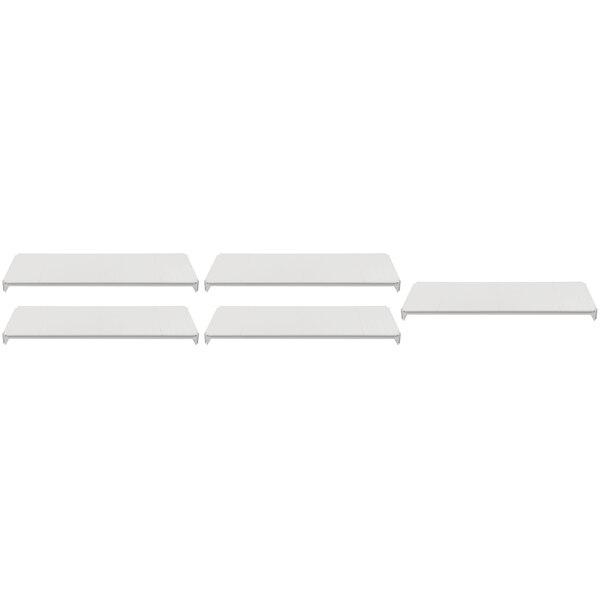A row of four white Cambro Camshelving® Premium shelves on a white background.