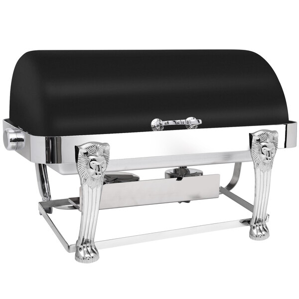 A black stainless steel rectangular roll top chafer with silver accents in an outdoor catering setup.