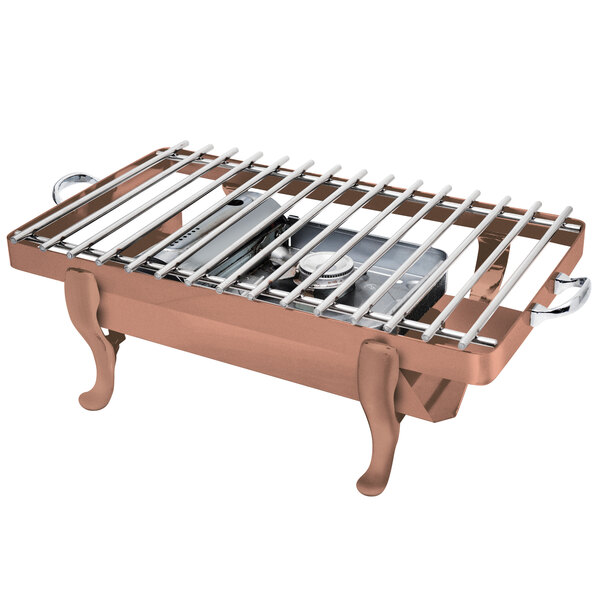 An Eastern Tabletop copper coated stainless steel grill stand with a removable grill top on a table.