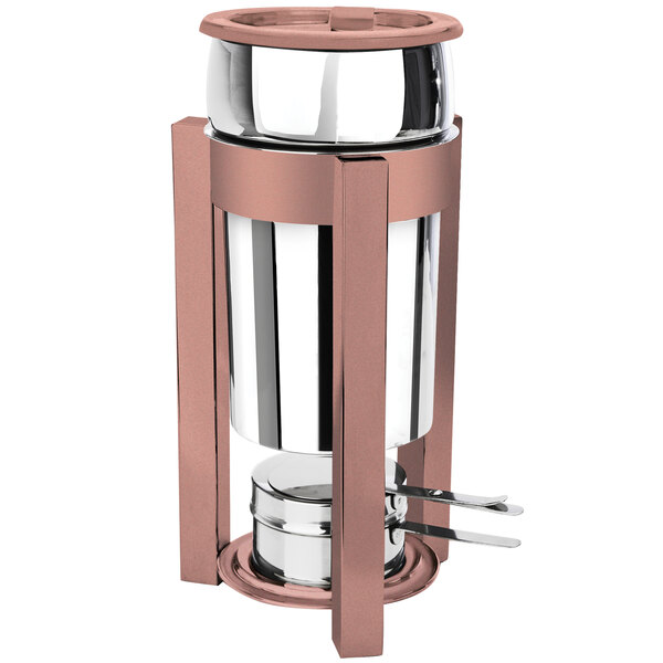 A stainless steel marmite with copper accents and a fuel holder.
