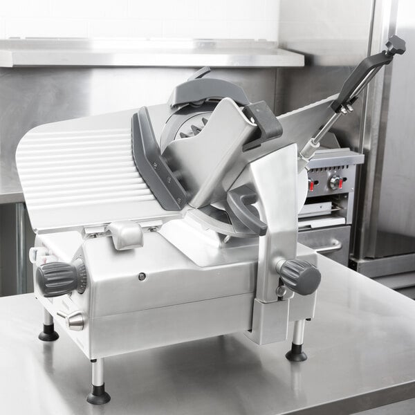 A Centerline by Hobart heavy duty automatic meat slicer on a metal table.