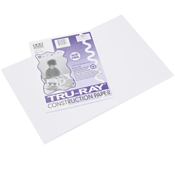 A close-up of a pack of white Pacon Tru-Ray construction paper with a purple and white label.