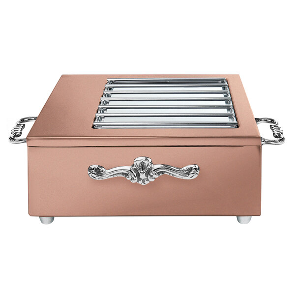 A copper coated stainless steel butane stove cover with grates.