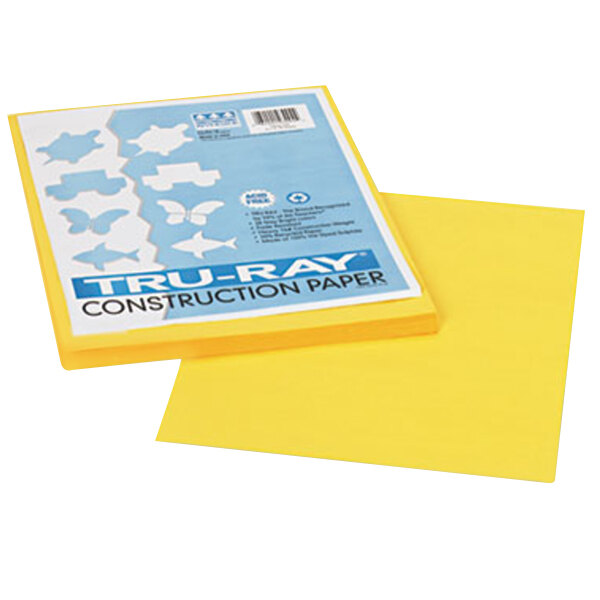 A yellow box of Pacon Tru-Ray yellow construction paper.