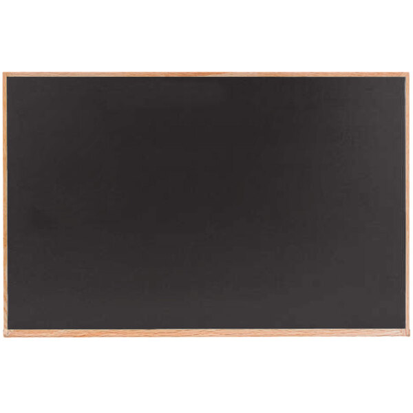 A black chalkboard with a solid oak wood frame.