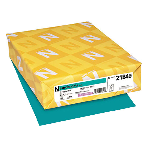 A yellow package of Astrobrights Terrestrial Teal color paper with white letters on it.