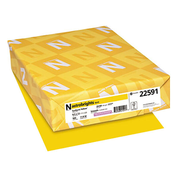 A yellow package of Sunburst Yellow Astrobrights paper with white and yellow designs.