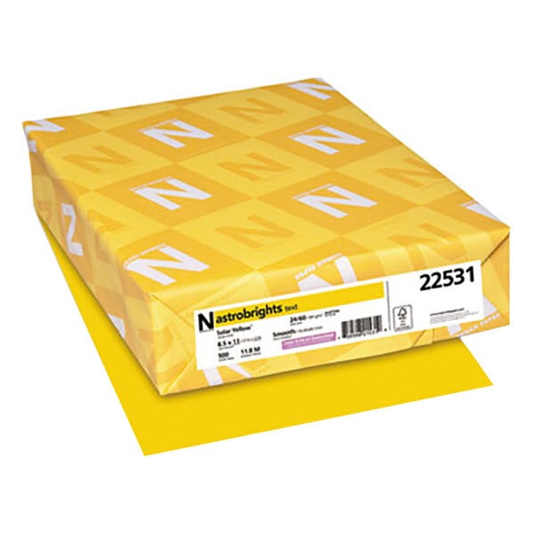 A yellow package of Astrobrights Solar Yellow color paper with white and yellow designs.