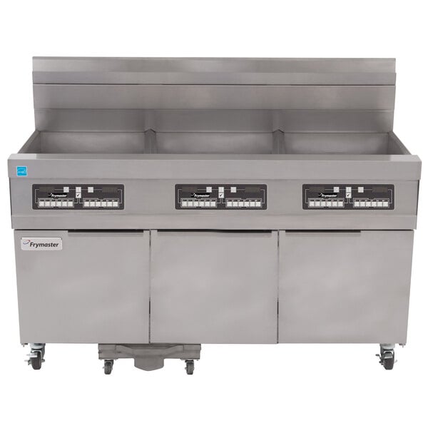 A stainless steel Frymaster floor fryer system with three drawers.