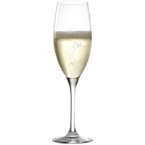 A close-up of a Stolzle Classic flute glass filled with champagne and bubbles.