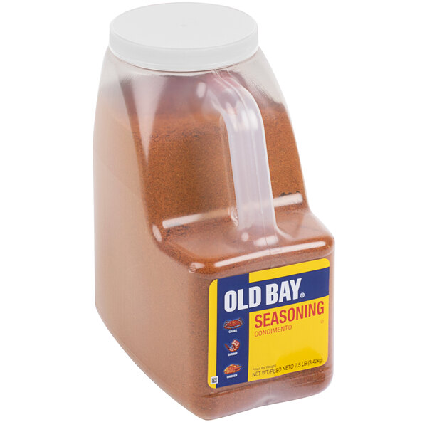 A plastic container of Old Bay Seasoning with a clear lid.