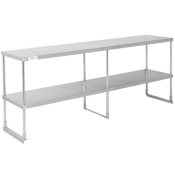 A Regency stainless steel double deck overshelf on a table with two shelves.