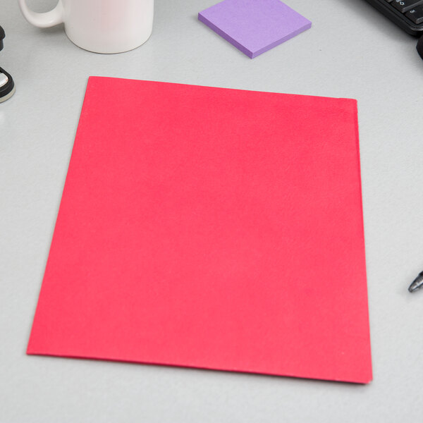 A red Oxford 2-pocket paper folder on a white surface.