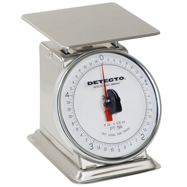 A Cardinal Detecto stainless steel mechanical portion scale with a rotating red dial.