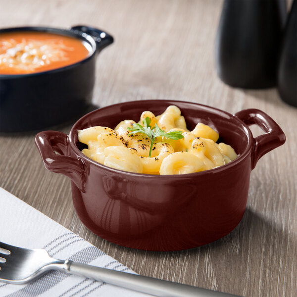 A Bon Chef burnt umber porcelain cocotte filled with macaroni and cheese.