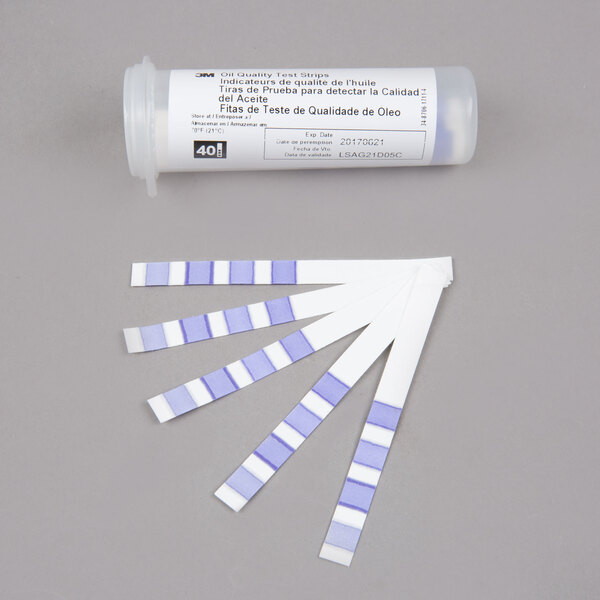 A tube of 3M Frying Oil Test Strips on a white surface.