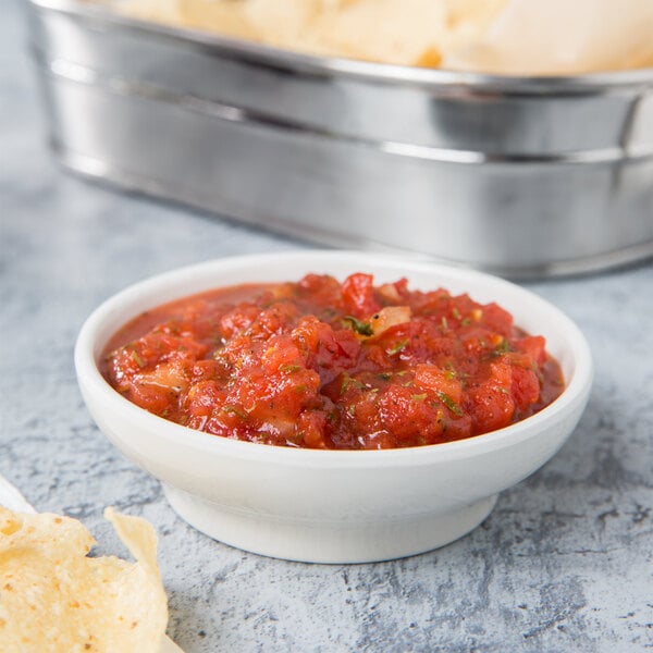 A bowl of salsa with chips in a Thunder Group bone melamine bowl.