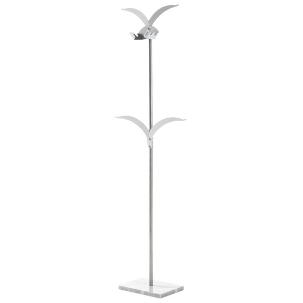A white marble base with a white metal pole and two metal wings on it.