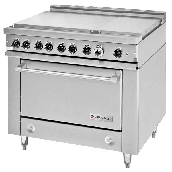 A large stainless steel Garland commercial electric range with 6 boiler top sections and a standard oven.