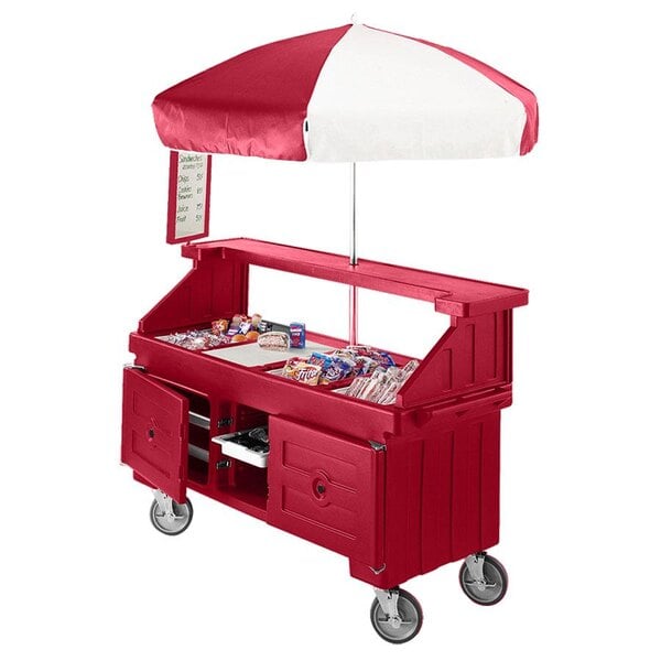 A red Cambro vending cart with a red and white umbrella.