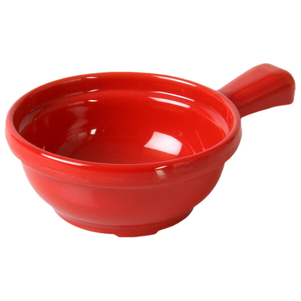 A close up of a red Thunder Group melamine soup bowl with a handle.
