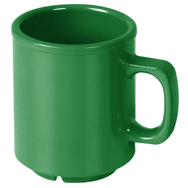 A green melamine mug with a handle.
