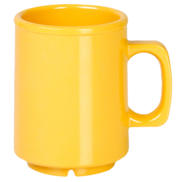 A yellow melamine mug with a handle.