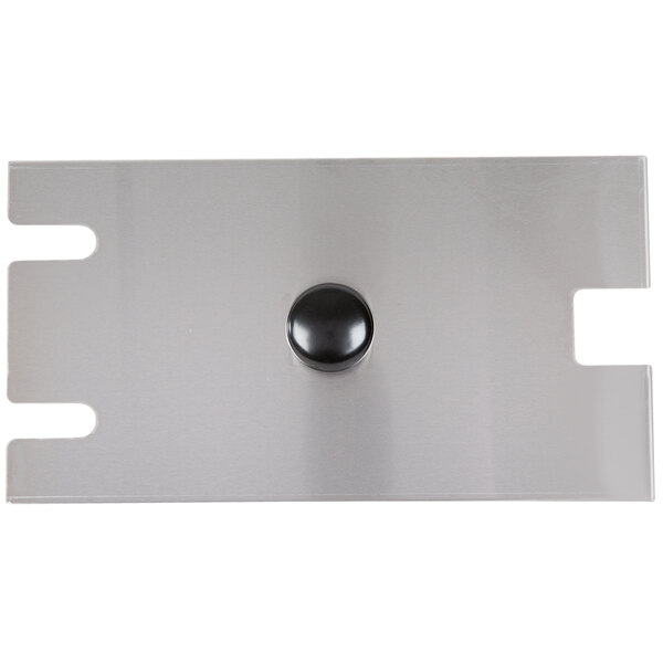 A metal plate with a black round button on it.