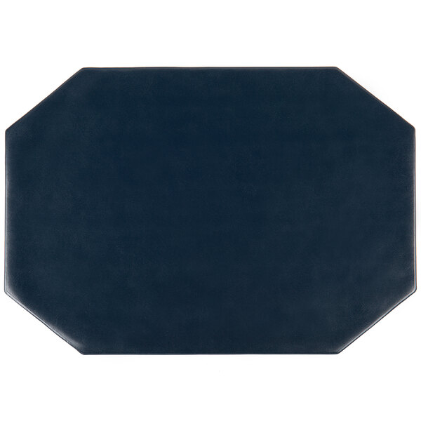 A blue octagon shaped placemat on a table.