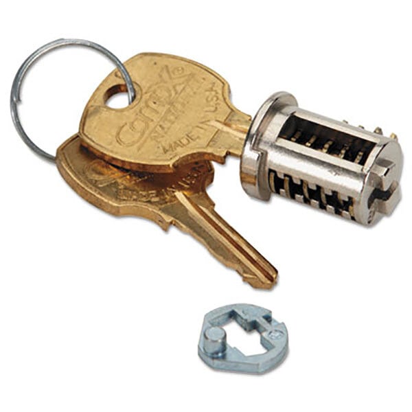 A close-up of a metal key with a key ring attached.