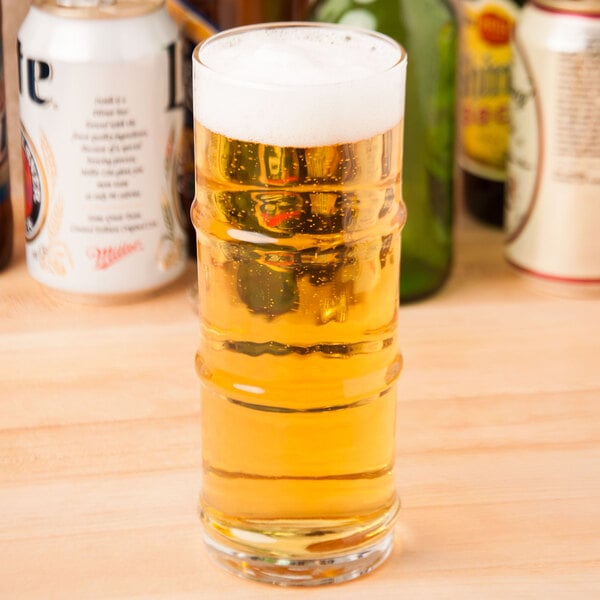 A Libbey Specialty Cooler glass of beer on a table.