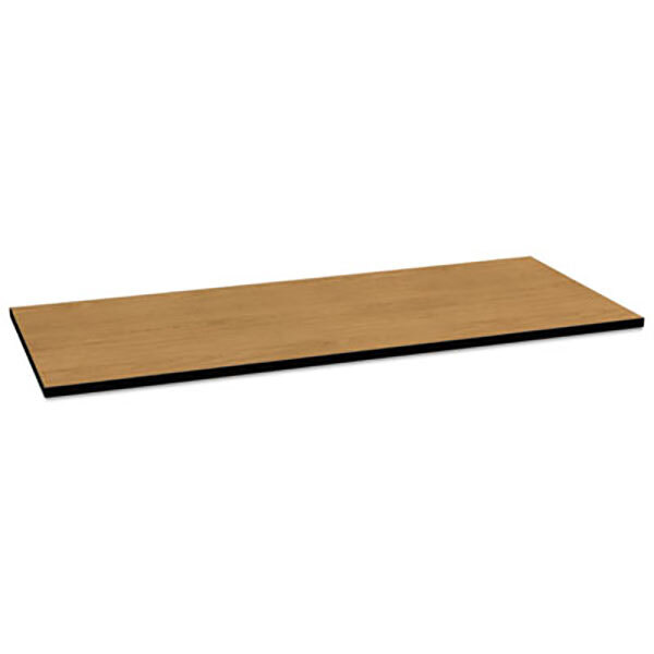 A rectangular wooden table top with a black edge on a brown table base.
