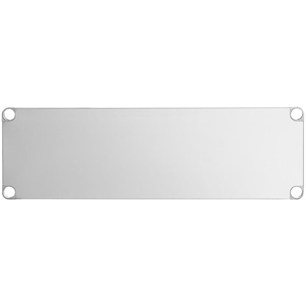 A white rectangular metal shelf with holes in the corners.