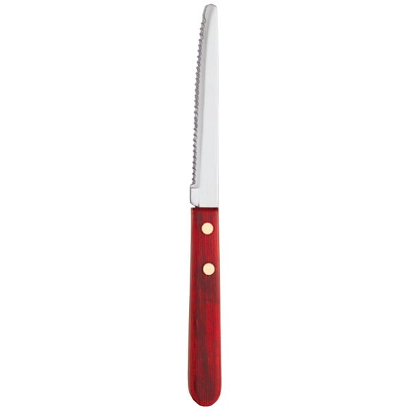 A Libbey stainless steel steak knife with a red Pakkawood handle.