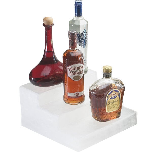 A Cal-Mil Classic Crystal Ice bottle display holding three bottles of liquor.