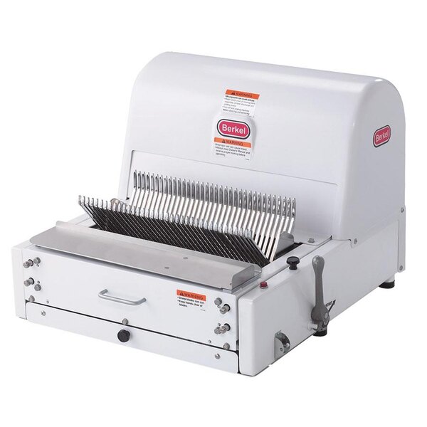 A white Berkel countertop bread slicer with a metal blade and a label on it.