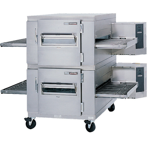 A Lincoln 1400 Series natural gas double conveyor radiant oven with a metal door open.