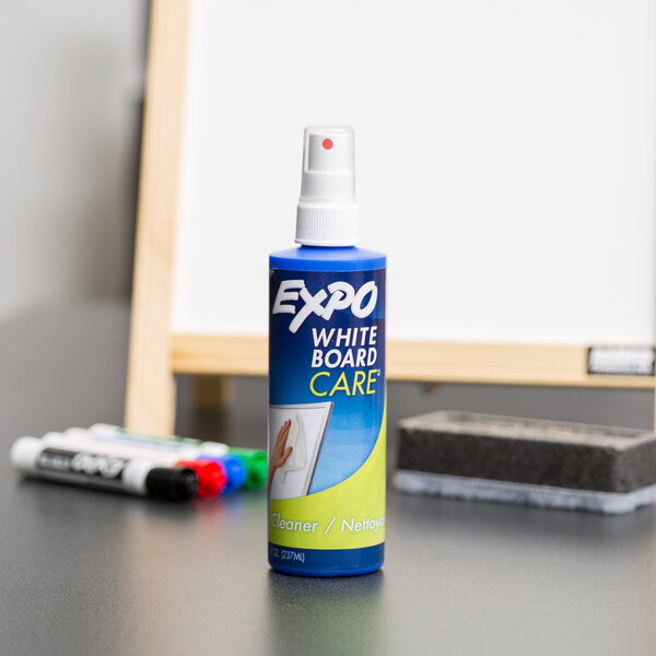 A blue bottle of Expo white board care spray.