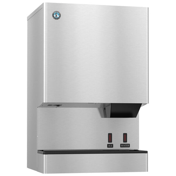 A silver stainless steel Hoshizaki ice machine with a black handle over a water dispenser.