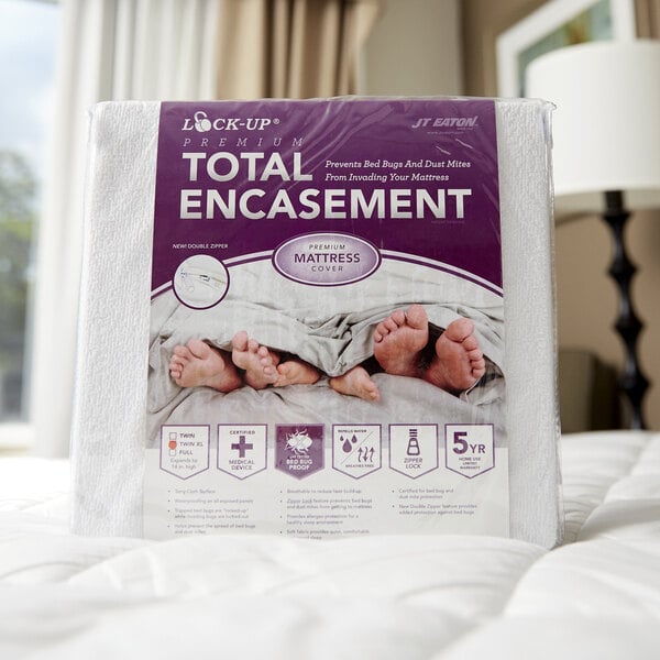 A white mattress with a JT Eaton Twin XL Bed Bug Proof Mattress Cover on a bed.