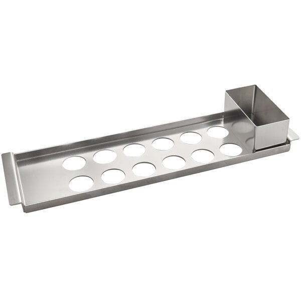 A Matfer Bourgeat stainless steel tray with holes in it.