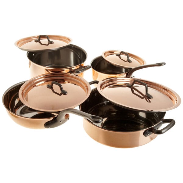 A group of Matfer Bourgeat copper cookware with lids.