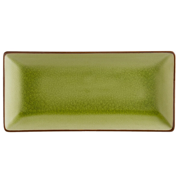 A green rectangular CAC stoneware plate with brown edges.