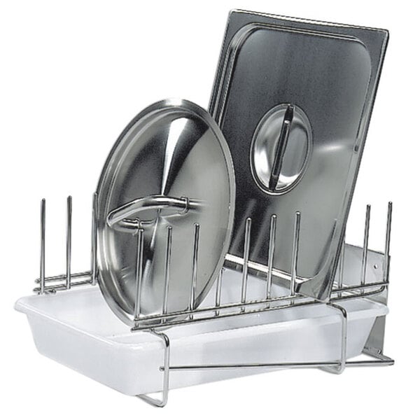 A Matfer Bourgeat stainless steel lid drying rack on a counter with plates and a bowl.